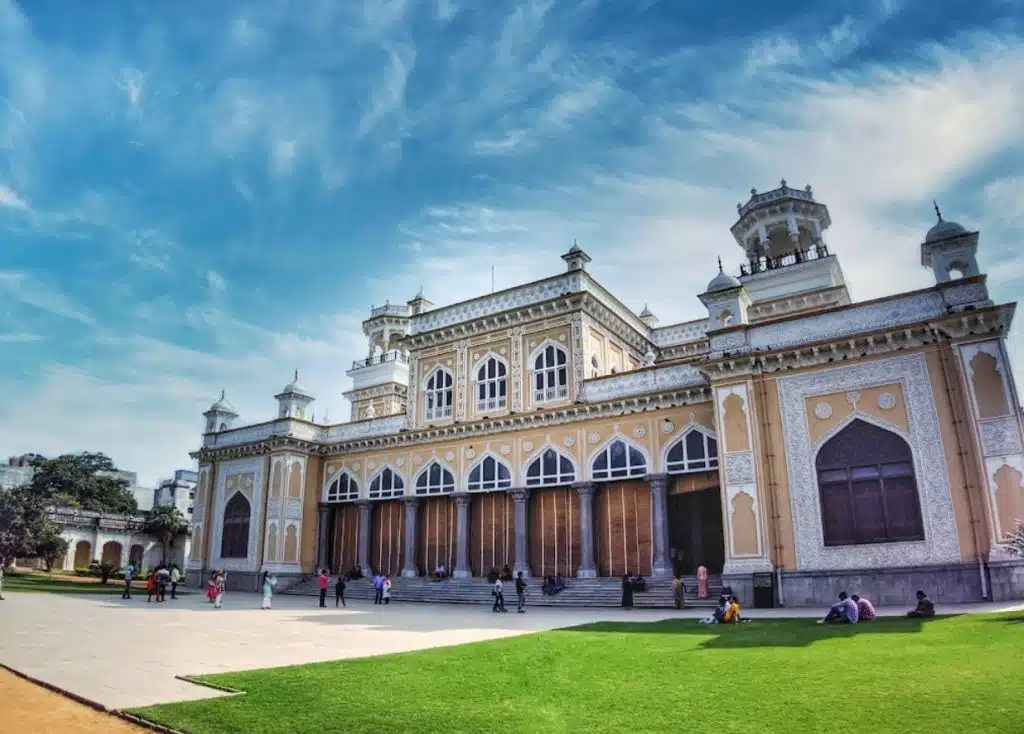 Chowmahalla Palace in Hyderabad, India - a grand palace complex with ornate architecture and spacious courtyards, surrounded by lush greenery.