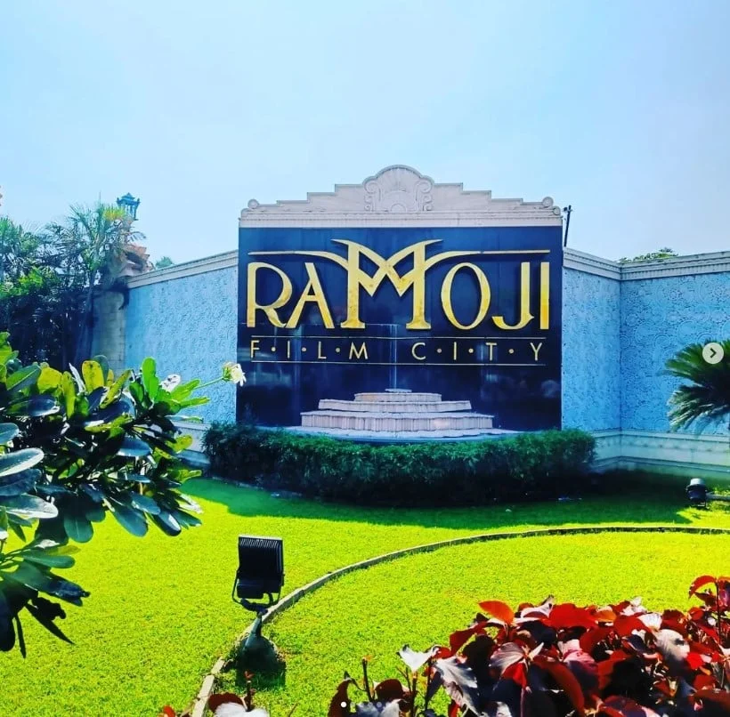 Ramoji Film City in Hyderabad, India - a movie studio complex with various sets and attractions, including gardens, buildings, and statues.